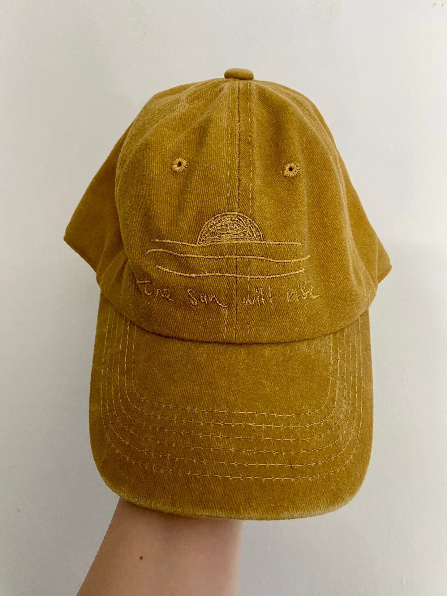 the sun will rise caps